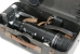 Close-up view of the camera and the accessories inside the metal storage container.