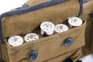 The various plug-in coils stored in a canvas pocket inside the suitcase.